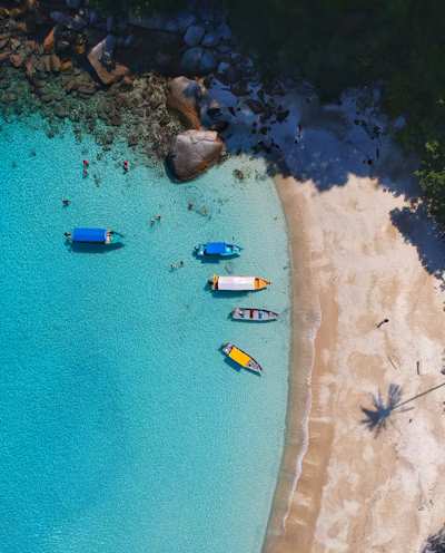 Long-tail boats on a beach in Thailand